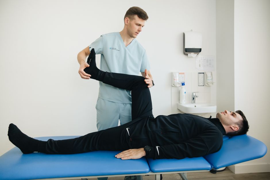 Therapist-assisted stretching session